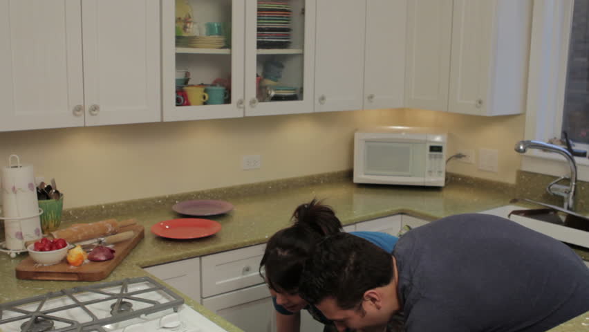 Couple cooking together in the kitchen