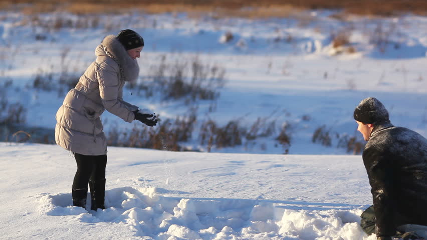 Young couple outdoors winter fun. 