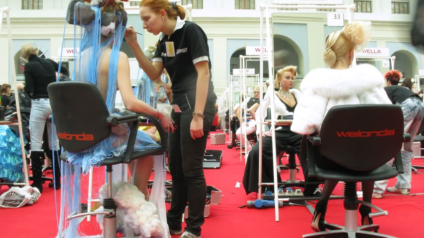 MOSCOW - SEPTEMBER 30: Hair stylists finish their models on XVII festival Mir Krasoty, September 30, 2010 in Moscow, Russia. Over 70 well-known cosmetics firms presented their goods and services at the trade fare.