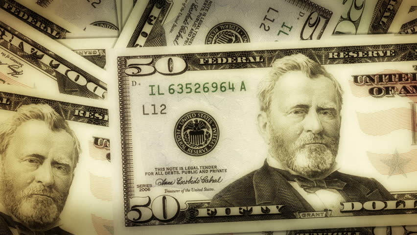 A pile of dollar notes gets smaller and opens up a hole with chroma key.