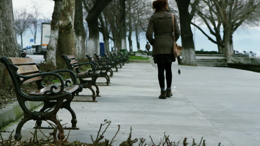 a woman walking down on the seaside