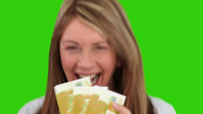 Mature woman proud of what she earned against a green screen
