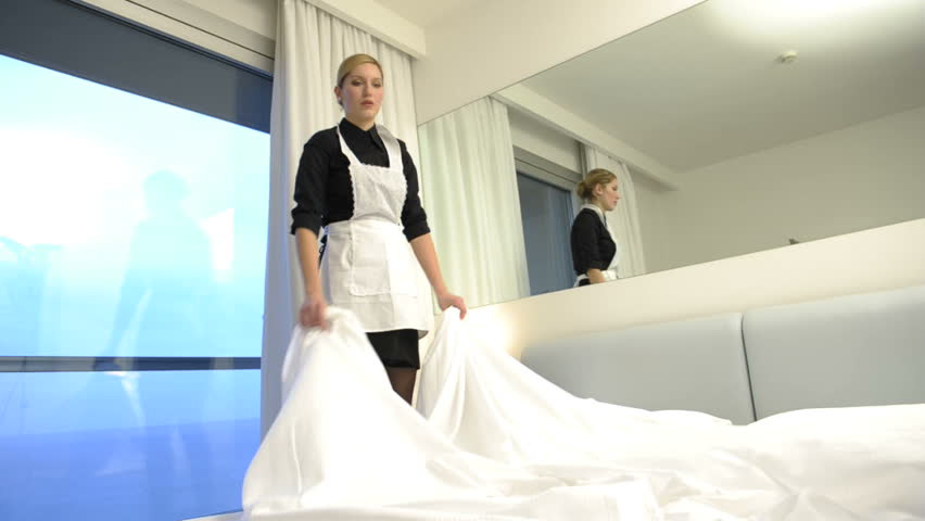 Maid making bed; HD Photo JPEG