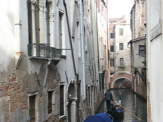 Venice: Gondola passage along an unknown canal