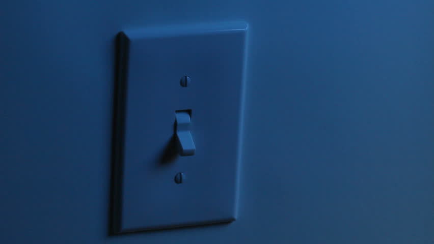 A women's hand flips a light switch on, and then turns it off. Two different backgrounds.