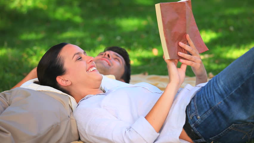 Couple lying on the grass taking a nap