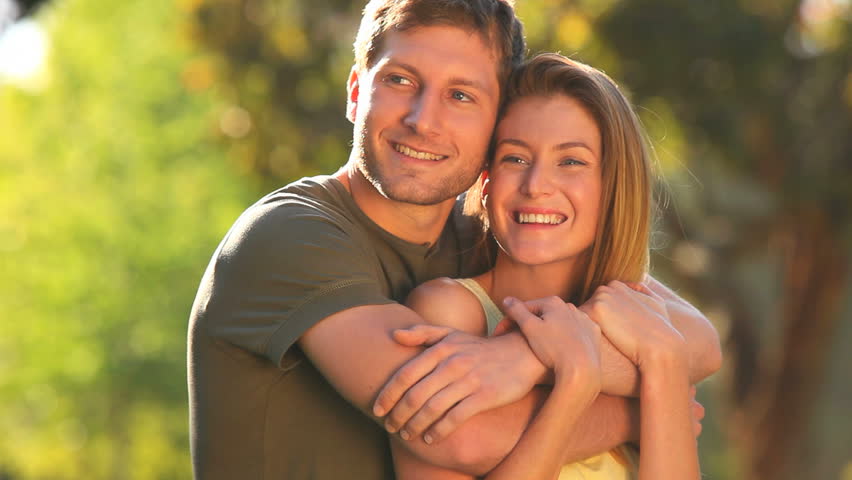 Couple in love cuddling in a park