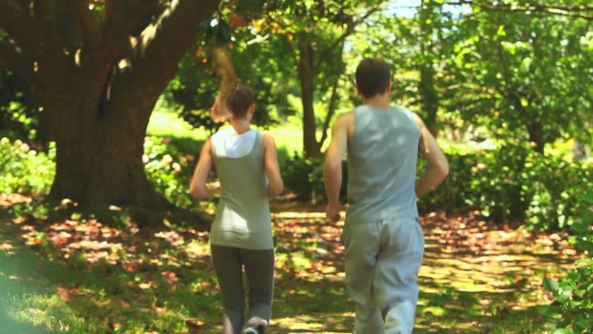 Couple running in the wood