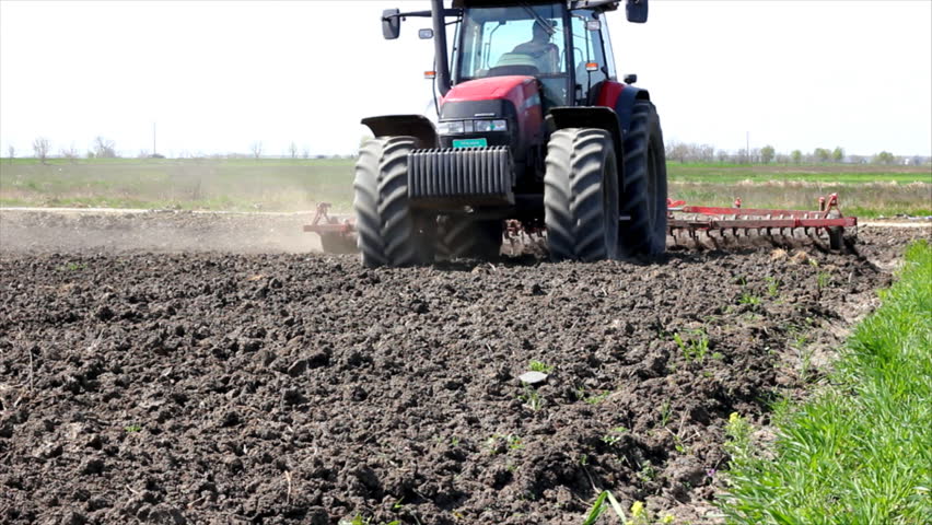 Tractors preparing land for sowing