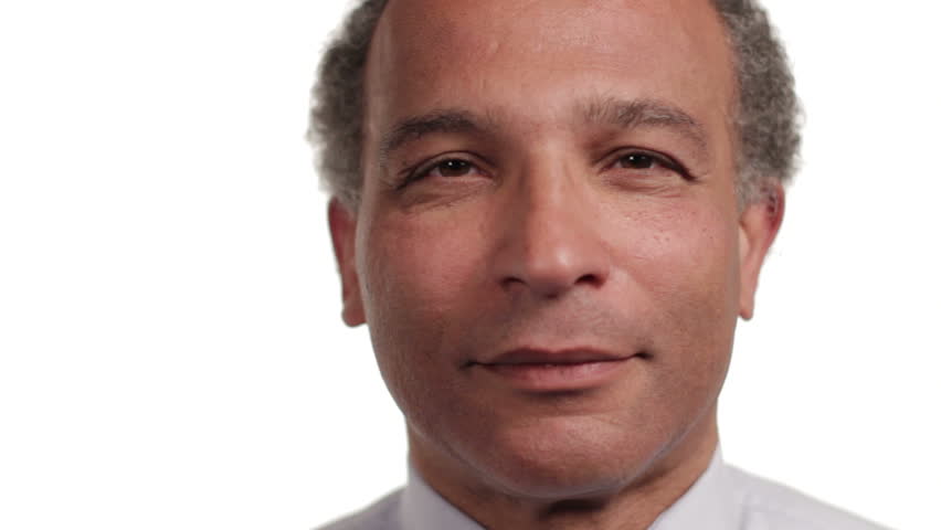 Mature African American man smiling, on white