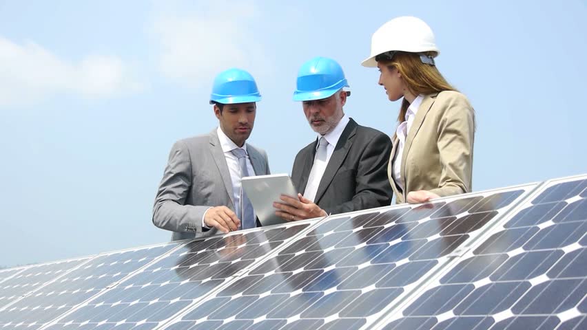 Engineers checking solar panels setup