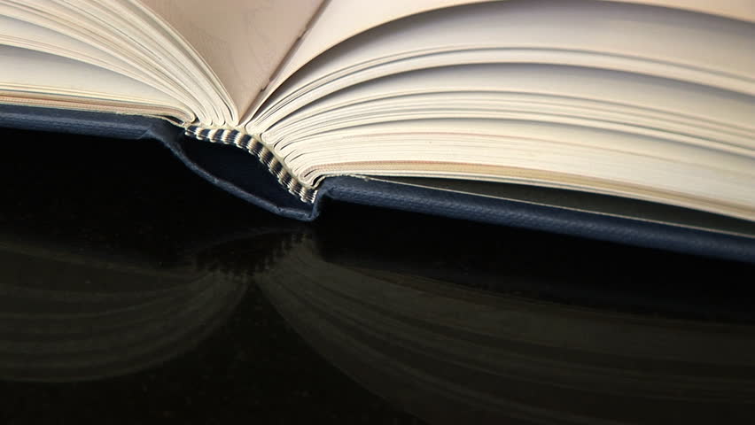 Close up of book being closed