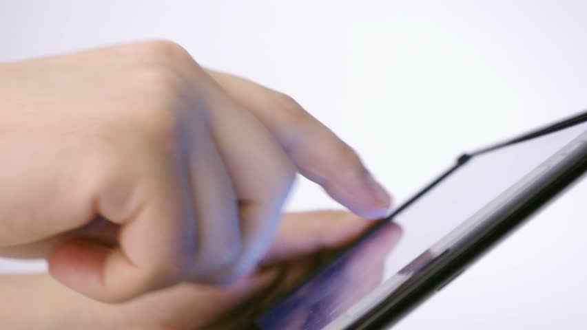 closeup shot of hand working on tablet pc touch screen