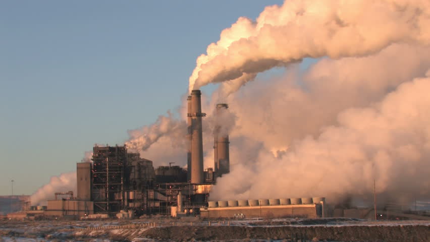 Video of pollution, smoke and steam discharged from a coal powered electrical generation facility in New Mexico. Contamination, pollution causing global warming and climate change. fast.