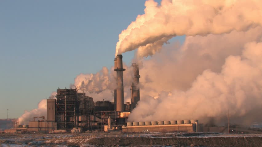 Video closeup of pollution, smoke and steam discharged from a coal powered electrical generation facility in New Mexico. Pollution contamination, pollution and global warming and climate change. 