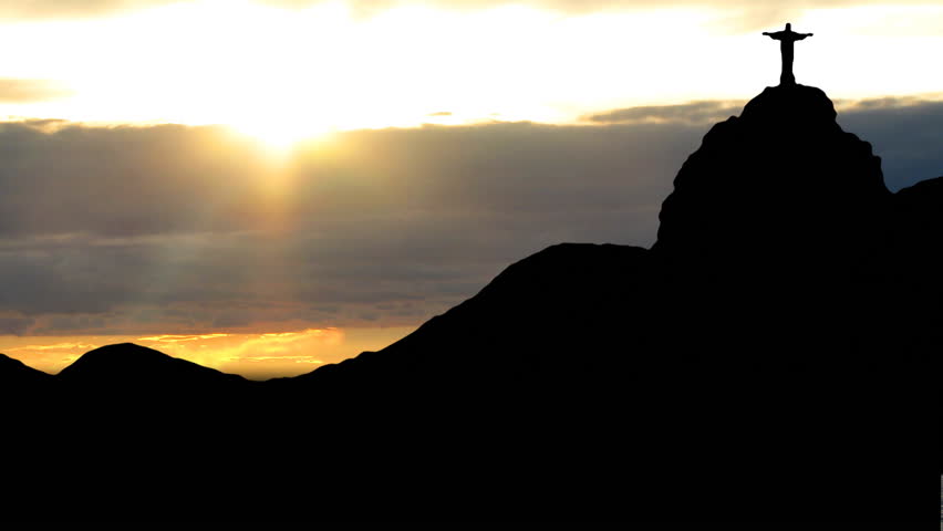 Rio de Janeiro, Sugarloaf with the statue of Christ, with the sunset in the background.
