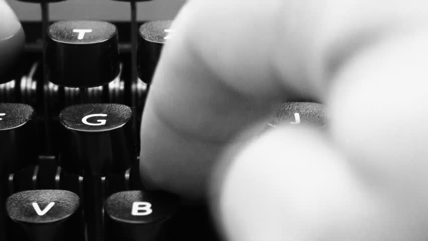 fingers on a typewriter