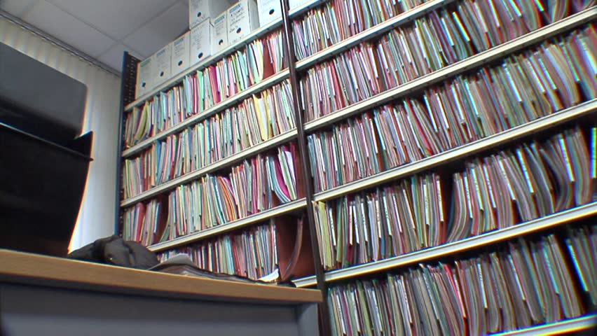 Binders on shelves in office