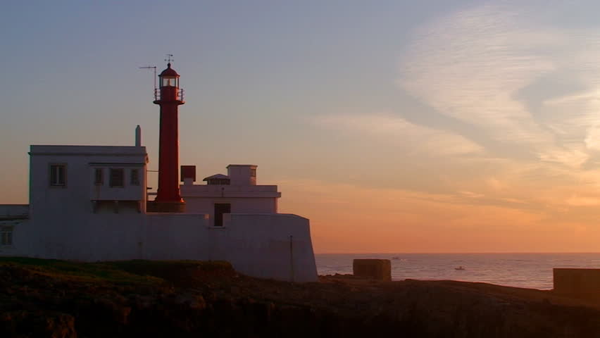 Lighthouse on the island at sunset