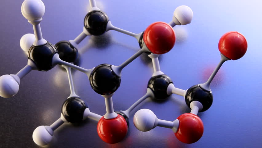 Model of drug (aspirin) molecule shot on reflective surface
