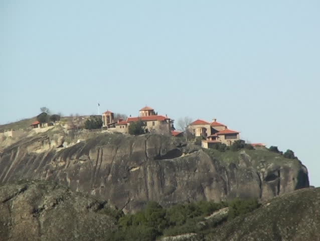 Zoom out of a monastery on top of the mountains at Meteora Greece