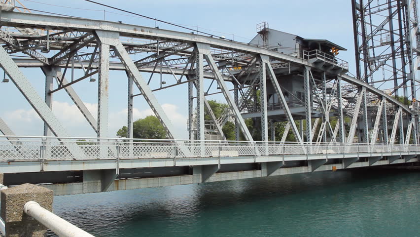 Bridge in downtown Port Colborne, Ontario, Canada.  This is a working lift bridge on the Welland Canal, that raises to allow commercial ships to pass underneath.  