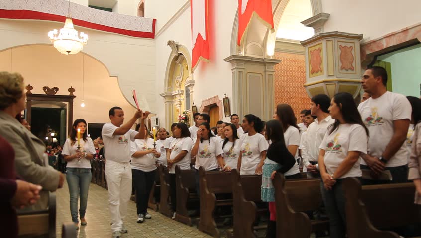 PARATY BRAZIL - JUNE 23: Catholics celebrate the presence of Cristo in the Eucharist with bread and wine during the Mass and procession of Corpus Christi in Paraty, Brazil, June 23 2011. 