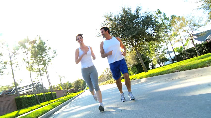 Athletic caucasian couple jogging to keep fit