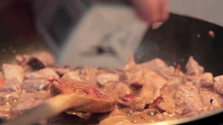 preparing meat with sauce