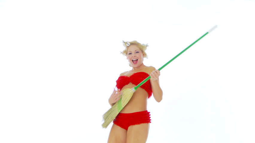 Woman rocking out with broom guitar