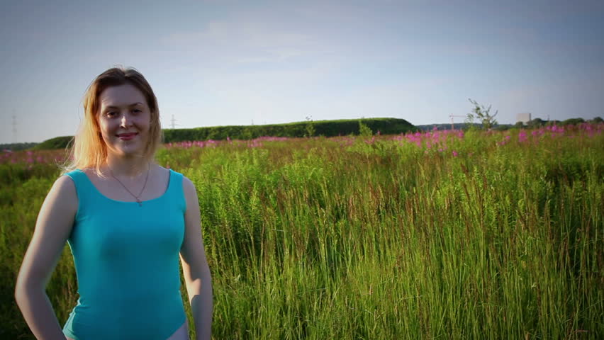 Young woman in summer field.