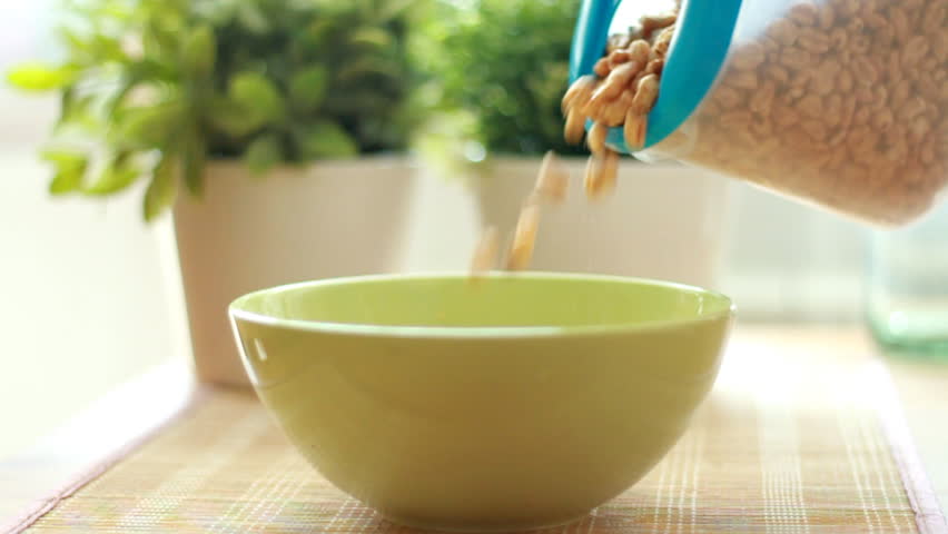 Pouring cornflakes into a bowl, slow motion