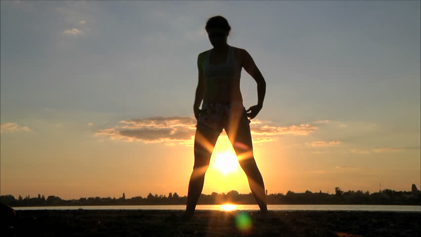girl is engaged in martial arts at sunset 2