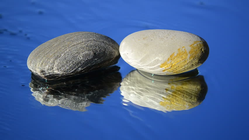 Clean water around the two small pebbles