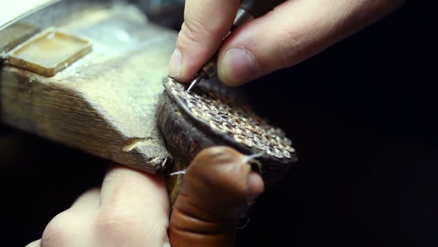 Labourer work with frames for jewels, closeup view