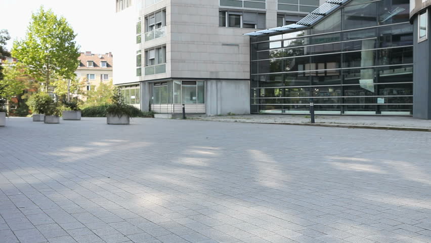 Disabled senior woman in wheelchair with nurse in the city