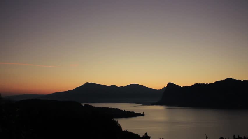 Sunrise at swiss mountains with lake lucerne in front