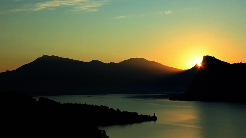 Sunrise at swiss mountains with lake lucerne in front