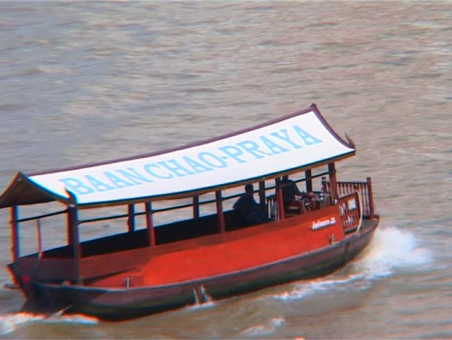 Small tourists boats on Chao Phraya river, bangkok, thailand 