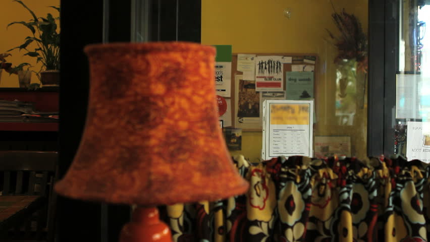 Shop owner hanging up open sign