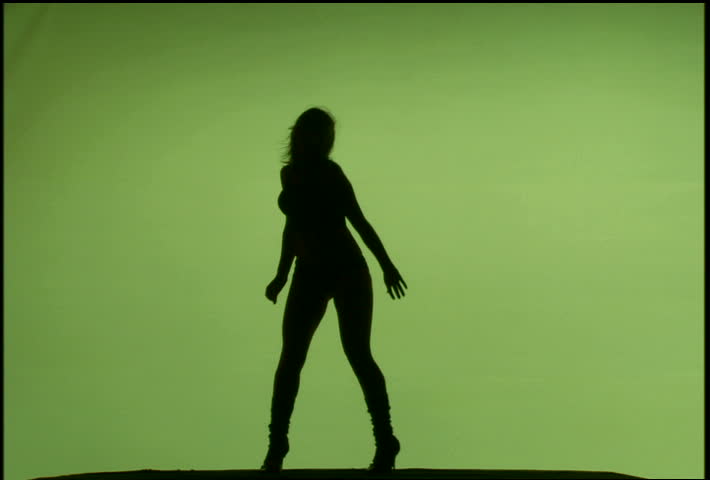A woman's silhouette dancing against green background
