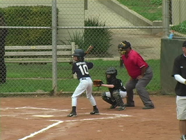 Batter ducking from a wild pitch.