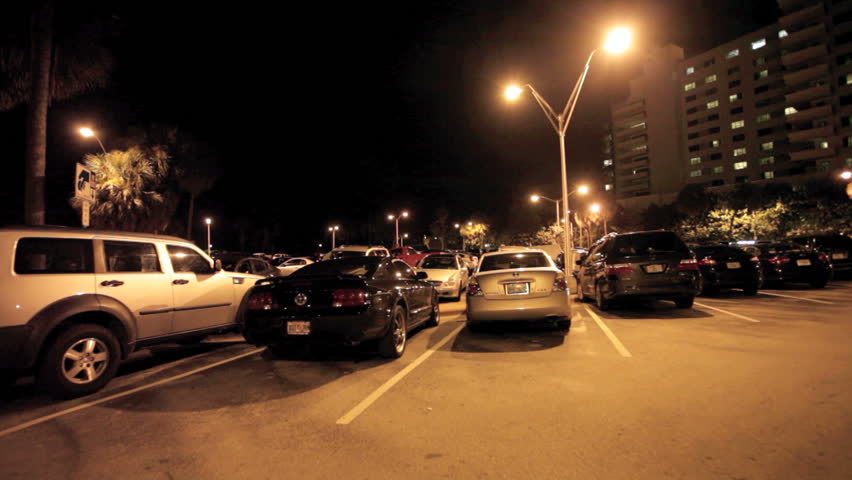 MIAMI BEACH, FLORIDA - SEPTEMBER 29: Camera stabilizer video of Miami Beach municipal Parking lot 71 at night in Miami Beach, September 29, 2011, Miami Beach, Florida, United States. 