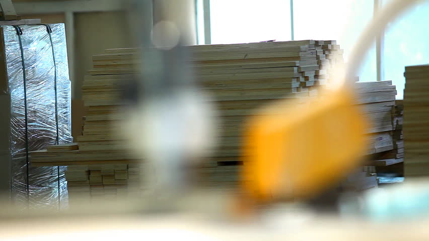 plywood factory - focus from circular saw to window