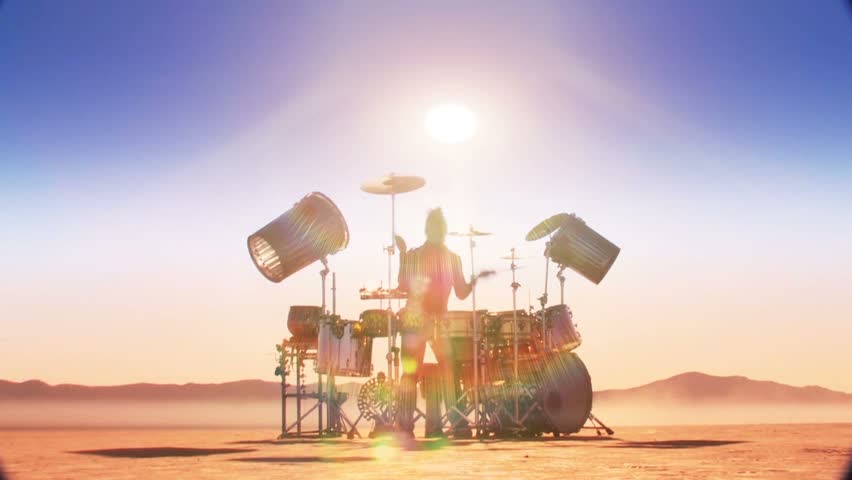 Drummer in desert (front shot with sun overhead) 