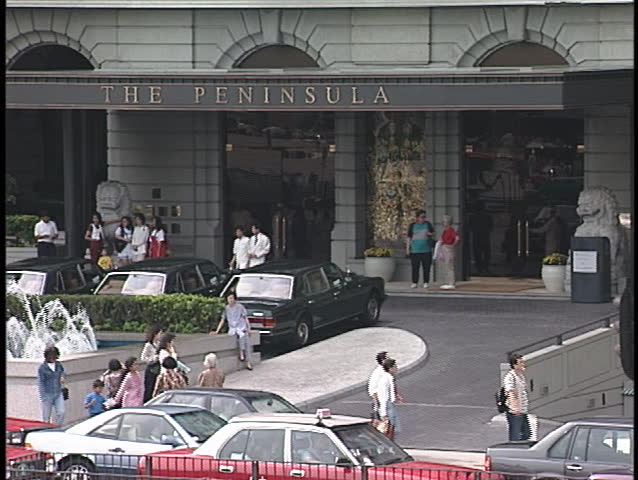 HONK KONG - CIRCA 1990s: Pedestrians cross a busy intersection circa 1990s in Hong Kong.