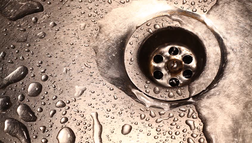 Close-up of kitchen sink with water drops