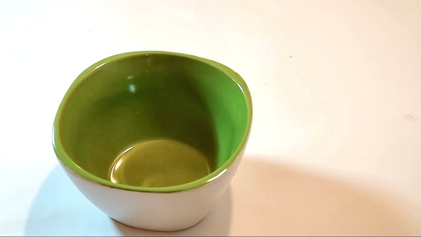 Pouring cornflakes in bowl