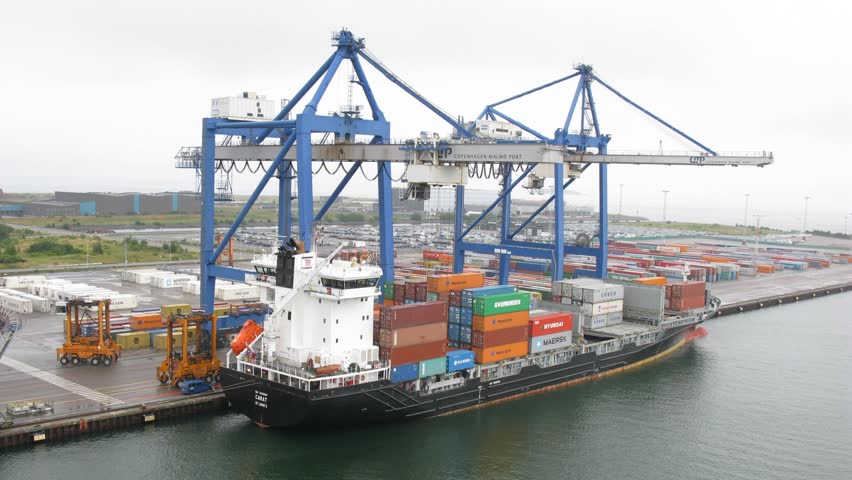 COPENHAGEN, DENMARK - JULY 12: Cranes load ship in port on July 12, 2011 in Copenhagen, Denmark. Copenhagen is the main gateway to the Baltic Sea.