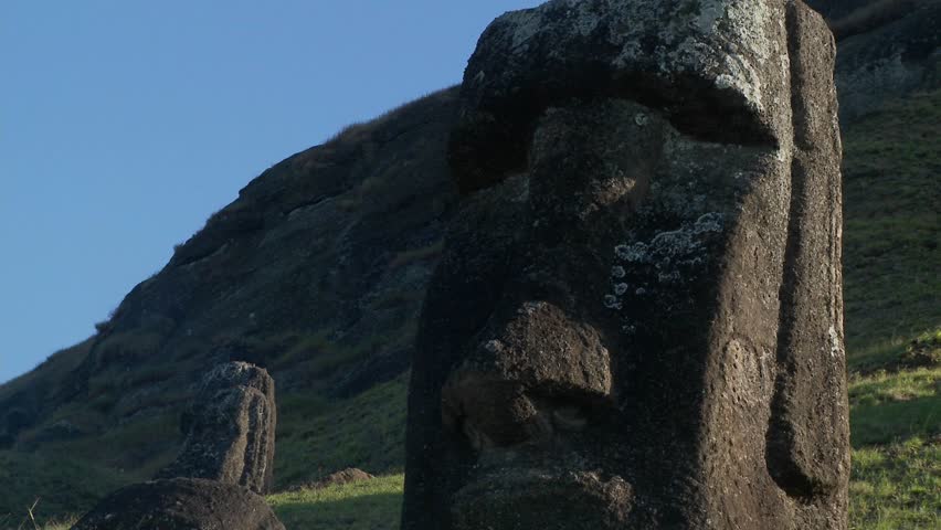 Giant half carved faces stand at the quarry on Easter Island.